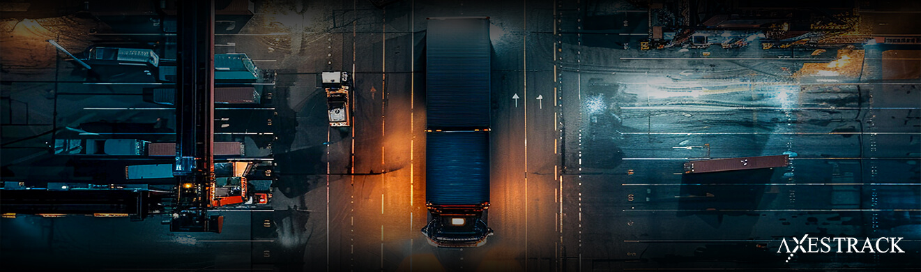 Aerial view of a manufacturing plant yard with trucks and equipment movement, representing asset tracking and real-time visibility across plant operations