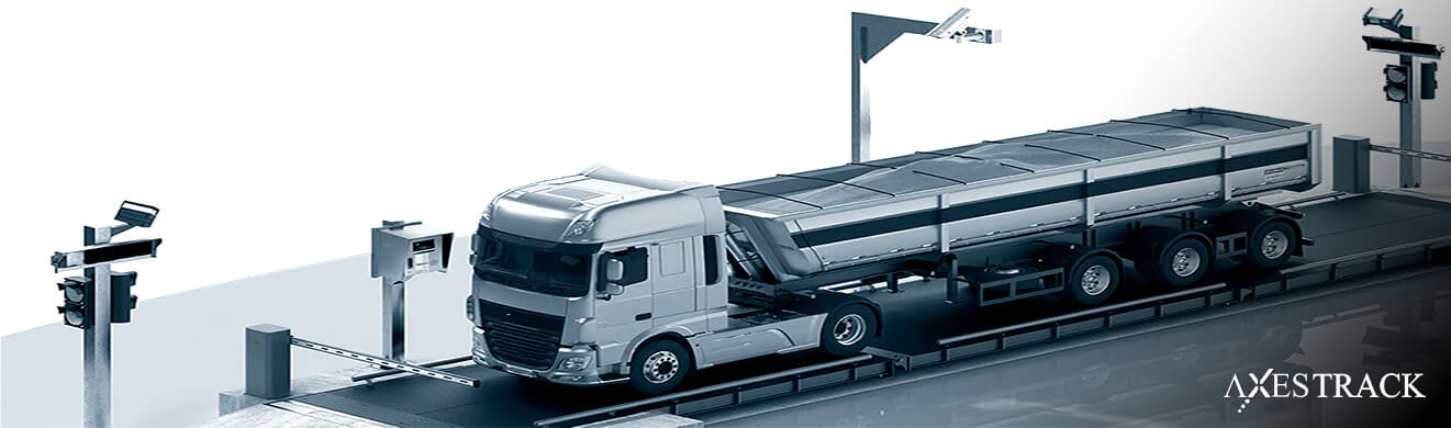 Truck on an automated weighbridge with sensors and control systems, representing weighbridge automation in plant logistics
