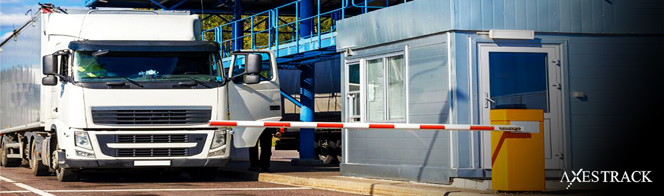 Truck at an industrial plant entrance with a barrier gate, representing digital gate pass and access control for plant security